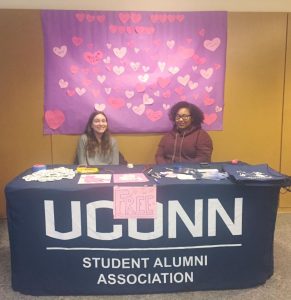 SAA volunteers staffing the "I Heart UConn Day" table in the Student Union. Photo by Kassi Montenegro.