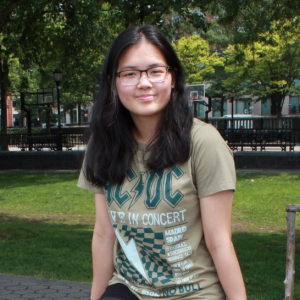 Ella smiling while sitting